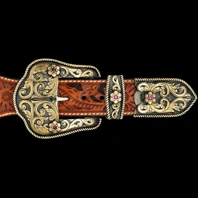 A custom western three piece belt buckle set featuring golden bronze accents and little flowers with pink zirconias